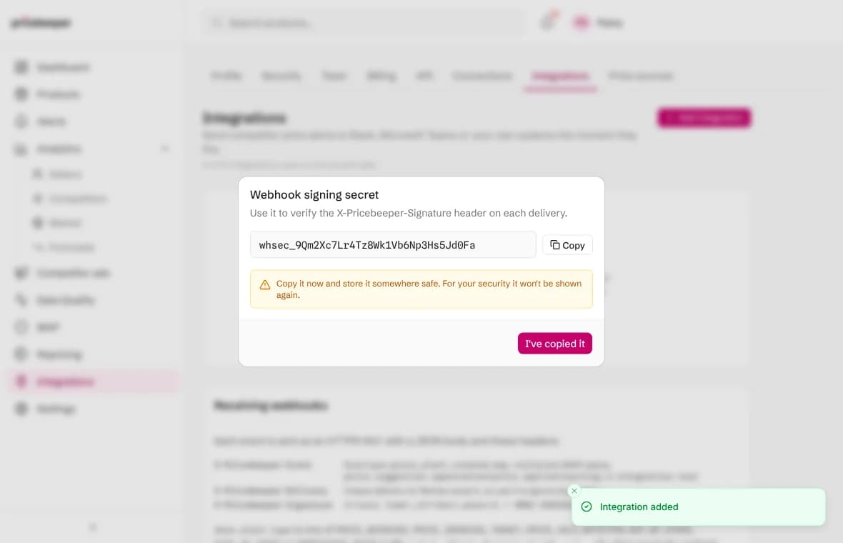 The webhook signing secret shown once after adding the Make integration